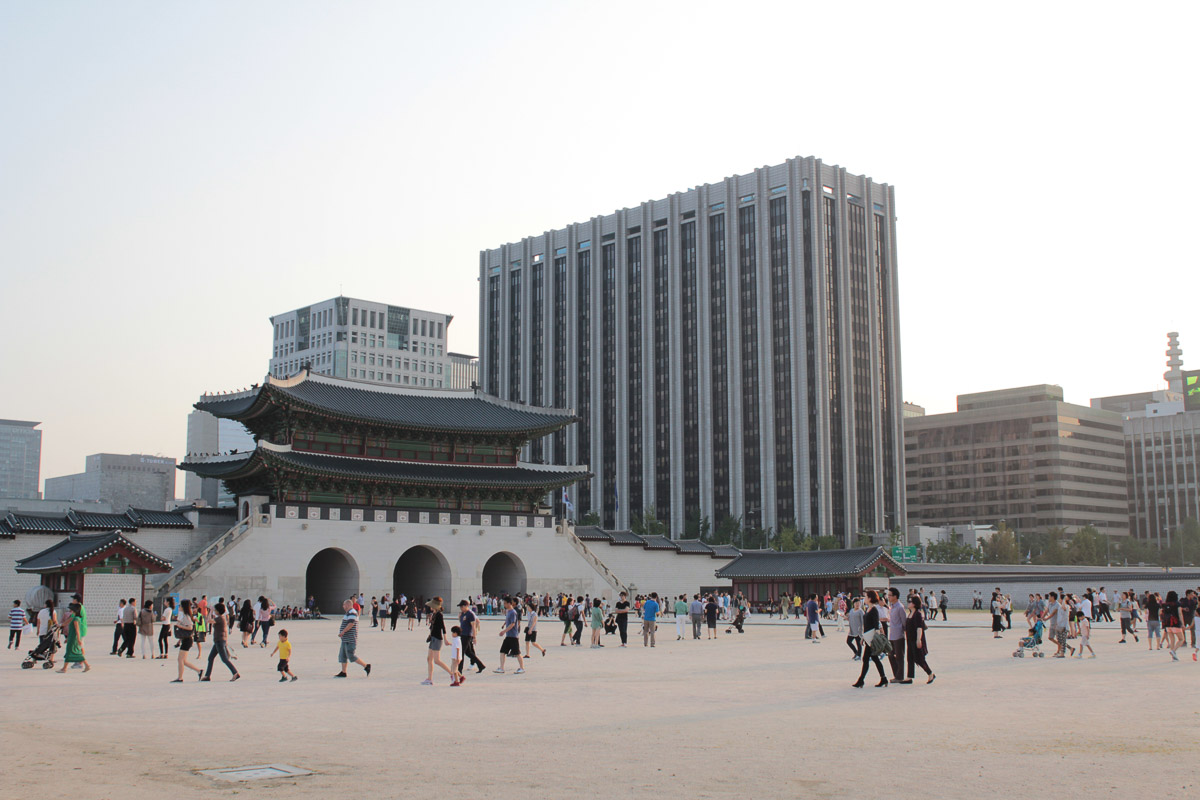 vast complex of Gyeongbokgung with modern seoul in background