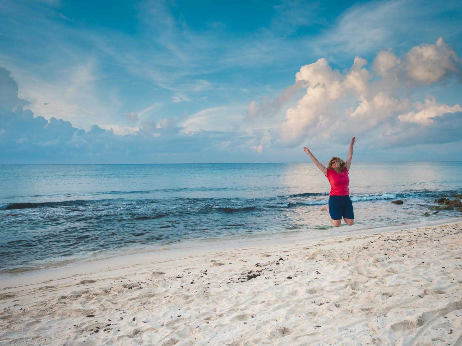 adults only resorts deb jumping on beach