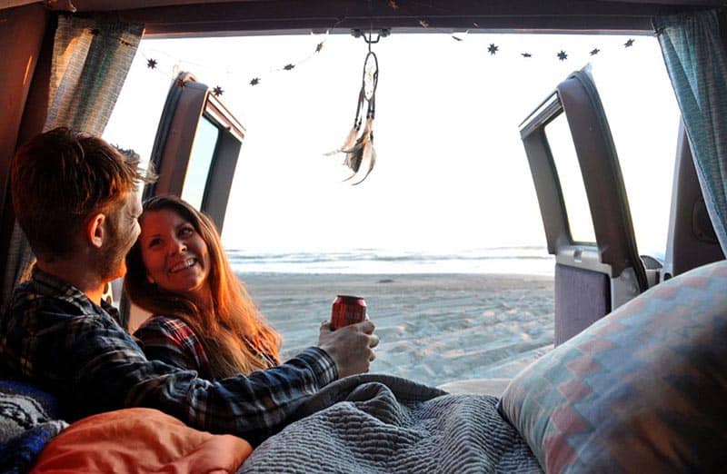 living in a campervan relaxing on the beach