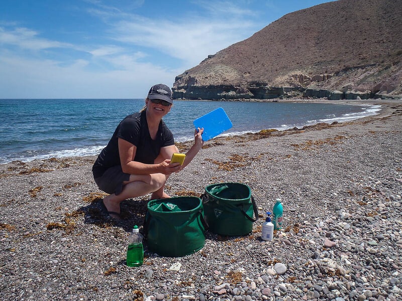 Baja, Mexico sea kayaking adventure Deb washing dishes